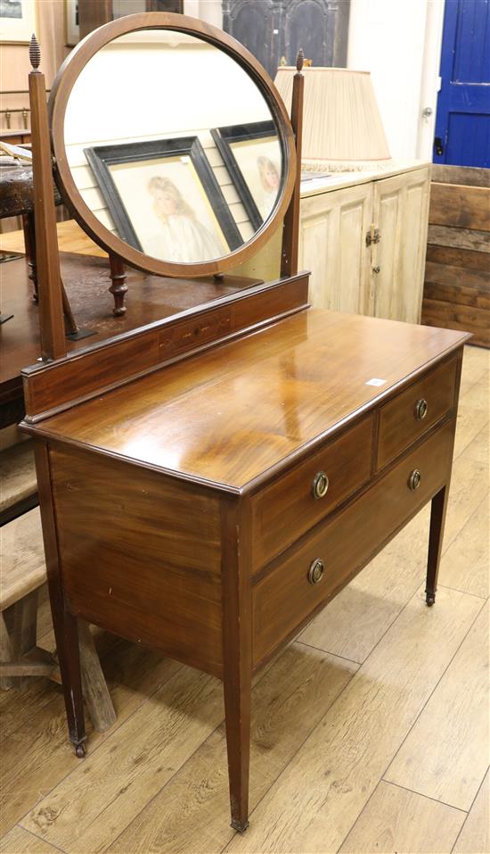 An Edwardian inlaid mahogany dressing table and matching cupboard W. 107cm dressing table, W.84cm cabinet